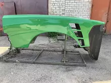 R310253 Боковина капота лів. John Deere